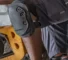 Worker wearing Ergodyne ProFlex knee pads while kneeling during industrial maintenance work.