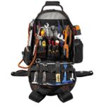 Open Ergodyne Arsenal backpack filled with hand tools, wrenches, and pliers in organized pockets.